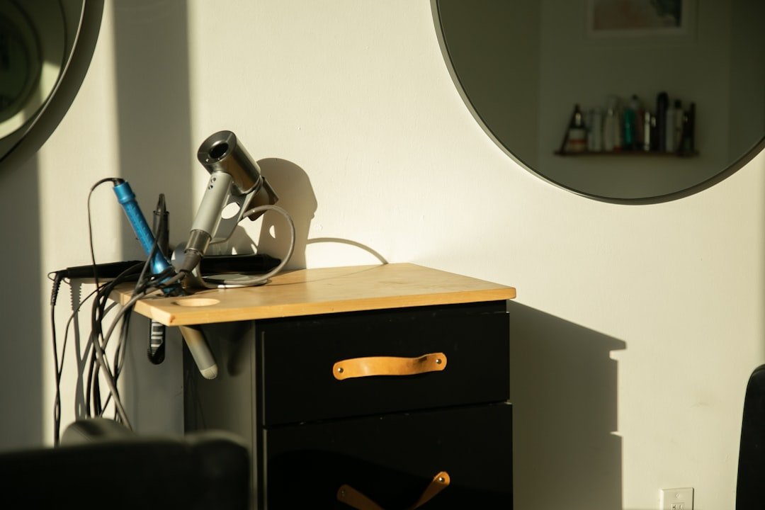 Professional at organized desk with morning sunlight, coffee, and clean workspace demonstrating an optimized work routine